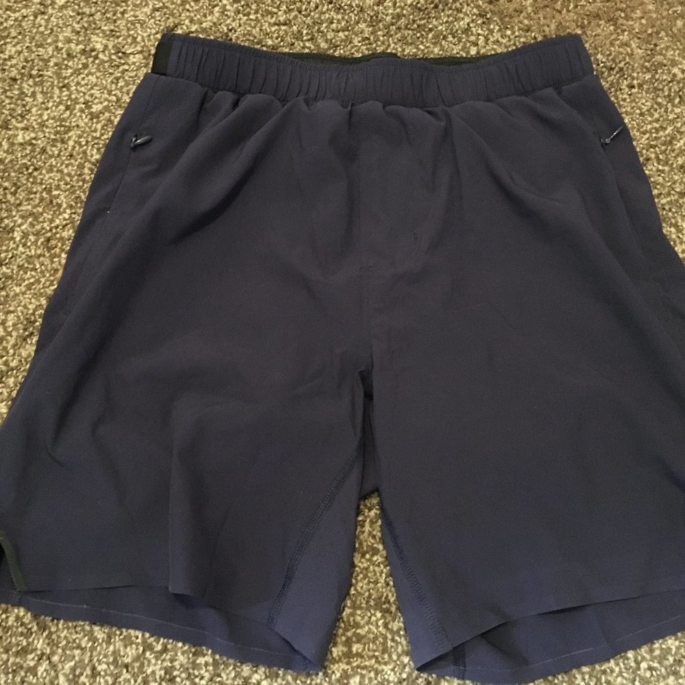 brand new Rhone running shorts